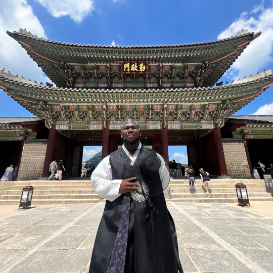 Komla Casimir Amezouwoe regally poses in Seoul, South Korea.