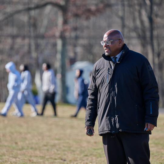 Lewis looking over kids during recess.