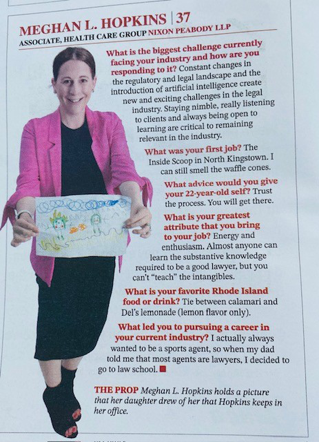 An article featuring Meghan Hopkins holding a basket of supplies in sensible purple blazer and black dress.