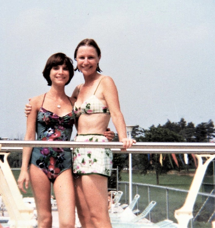 old photo of Lois (Greene) Stone and friend on a beach front property.