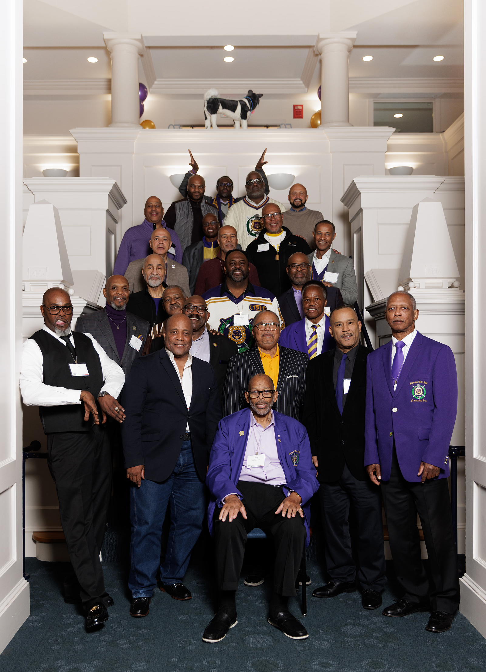 Alumni from the Omicron Eta chapter of Omega Psi Phi Fraternity Inc. pos for a photo