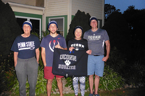 Greiner family poses with UConn gear