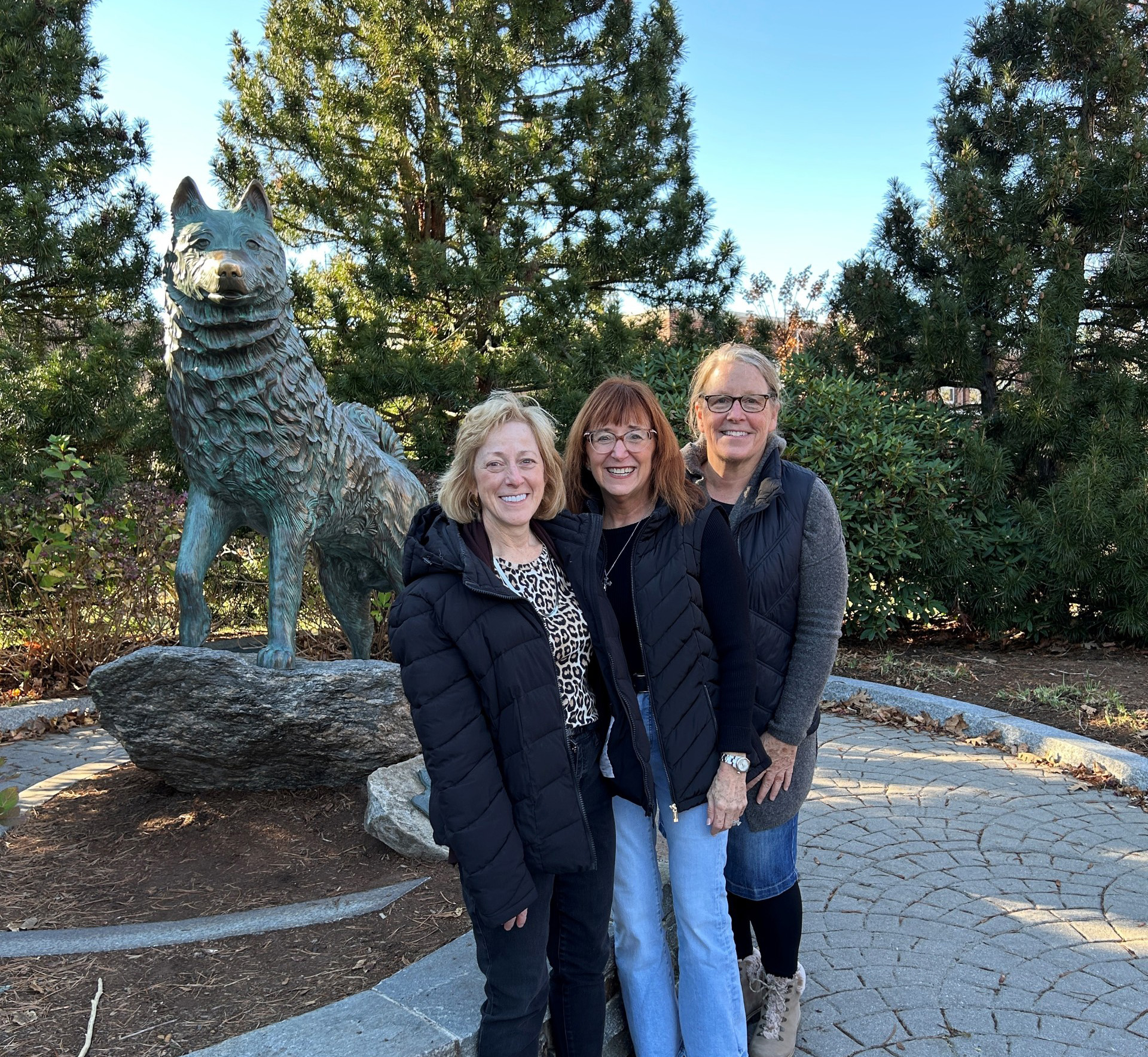 Kathy, Martin, and Lisa pose in front of Jonathon statue.