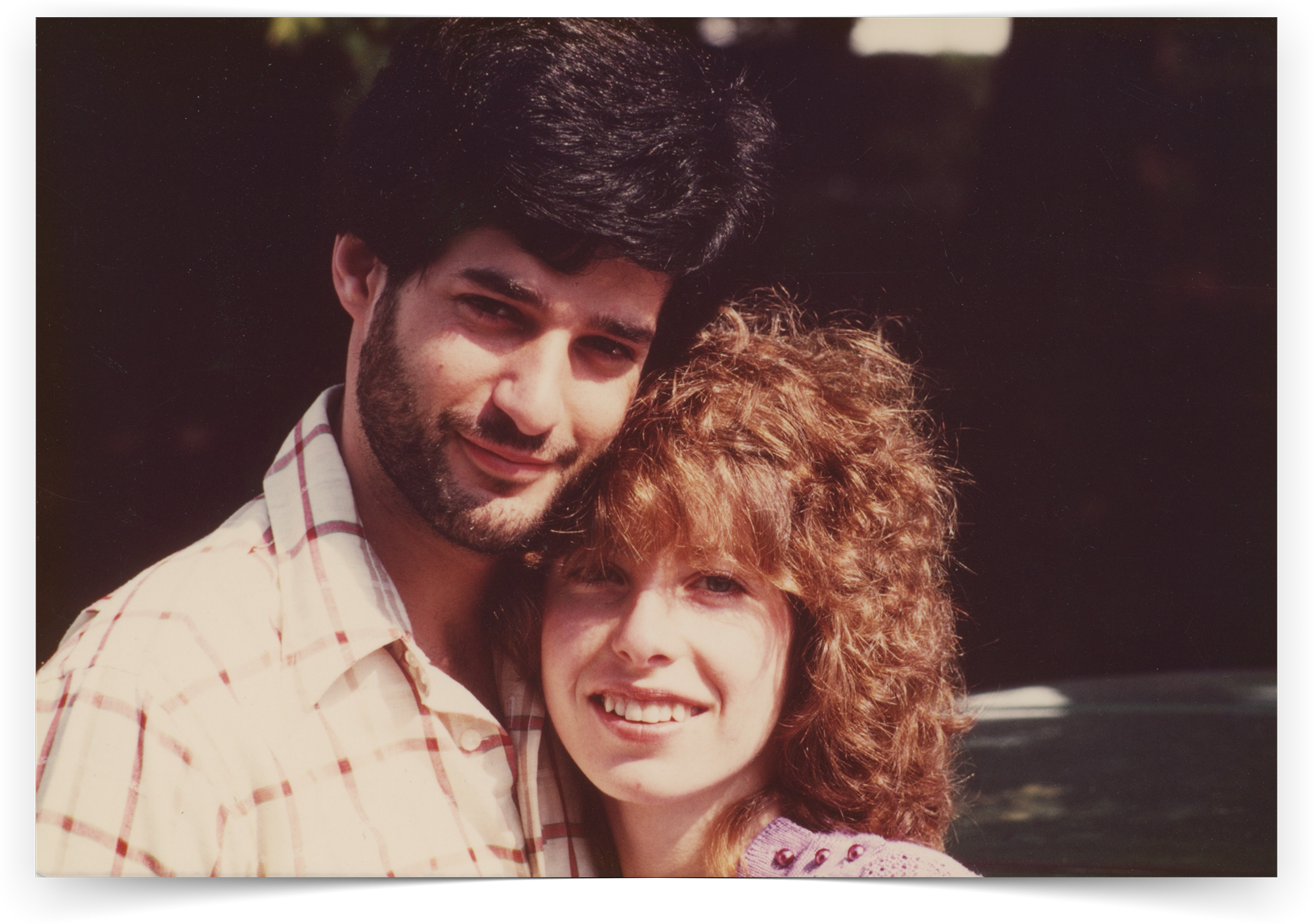A vintage photo of Arthur and Gina, posing happily for the camera.