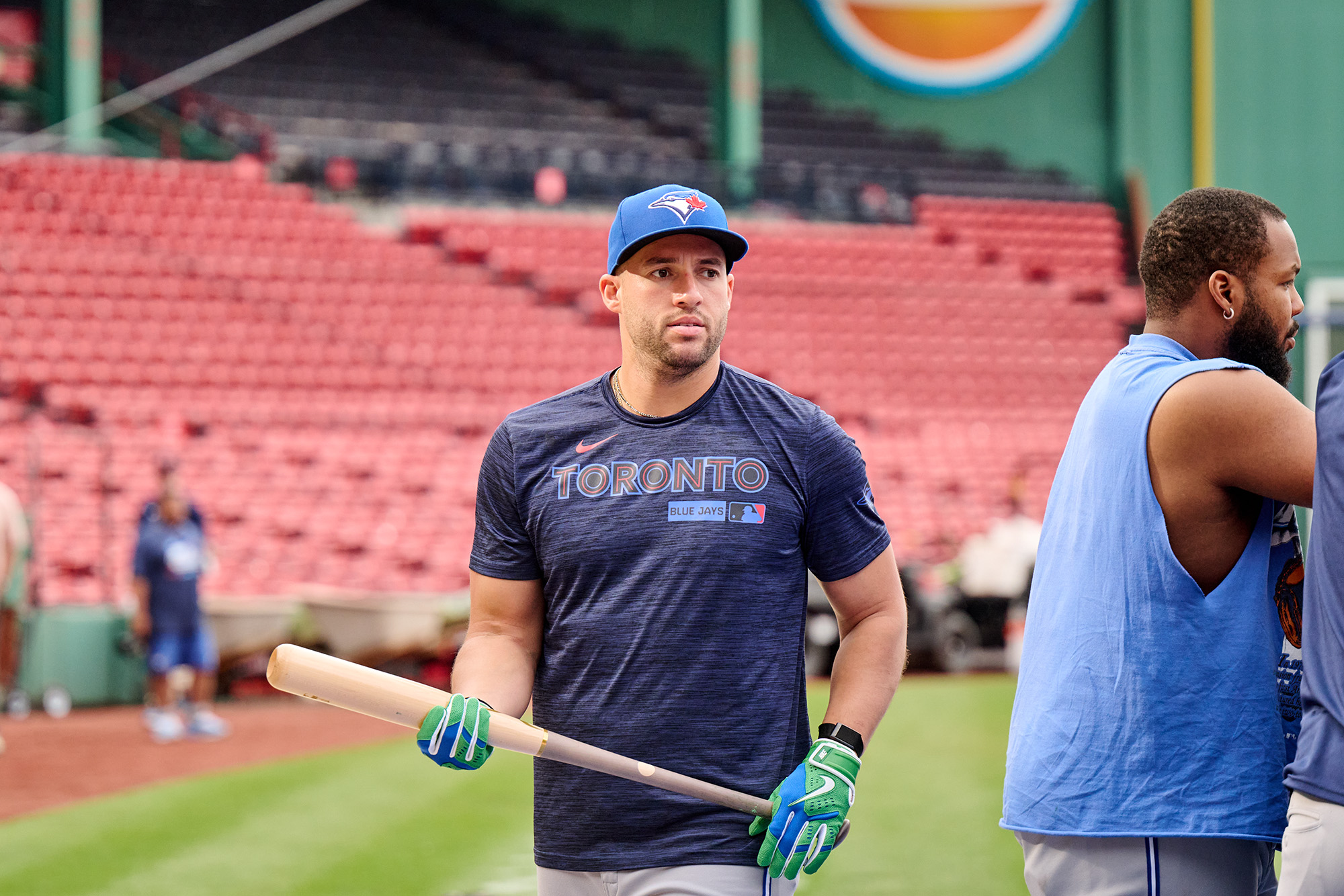 Springer in a blue Toronto shirt, holding a baseball bat in both hands.