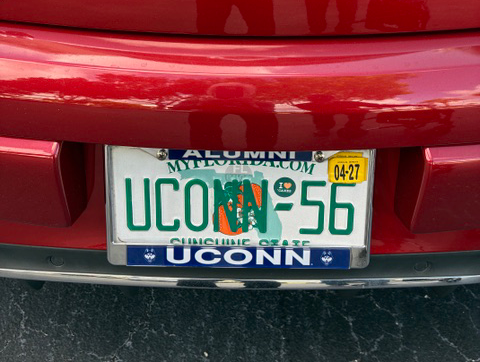 UConn 56 license plate on a red car