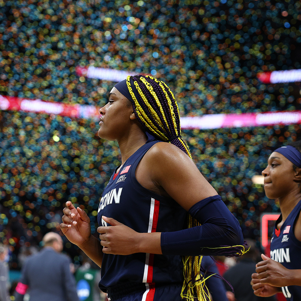 MINNEAPOLIS, MINNESOTA - APRIL 03: Aaliyah Edwards #3 and Christyn Williams #13 of the UConn Huskies run off the court after being defeated by the South Carolina Gamecocks 64-49 iduring the 2022 NCAA Women's Basketball Tournament National Championship game at Target Center on April 03, 2022 in Minneapolis, Minnesota. (Photo by Elsa/Getty Images)